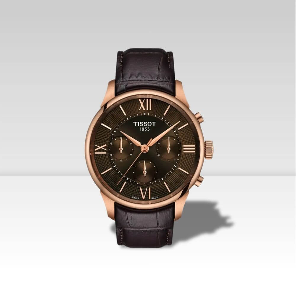 Orologio Tissot Chemin des Tourelles Powermatic 80 con cassa oro rosa, quadrante marrone e cinturino in pelle.