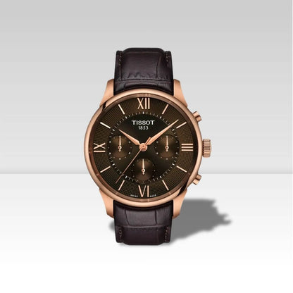 Orologio Tissot Chemin des Tourelles Powermatic 80 con cassa oro rosa, quadrante marrone e cinturino in pelle.